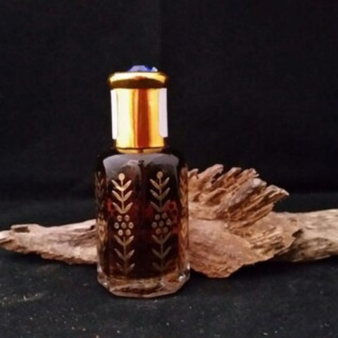 Sacred Oud Essence Bottle – Floral Gold Design.