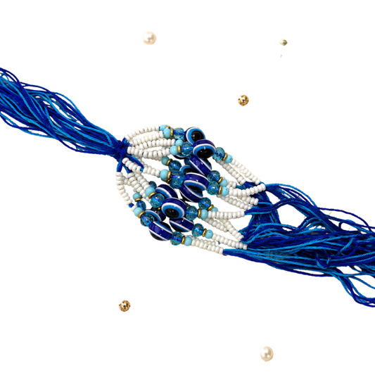 Evil Eye Lumba Rakhi – Blue & White Pearl Beads with Designer Tassel