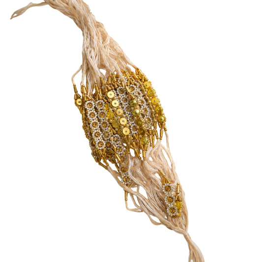 Traditional Lumba Rakhi – White Thread with Golden Bead & Stone Work